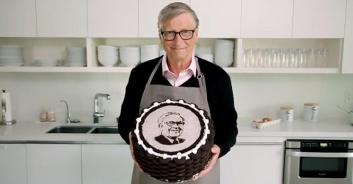 Bill Gates with the cake for Warren Buffet